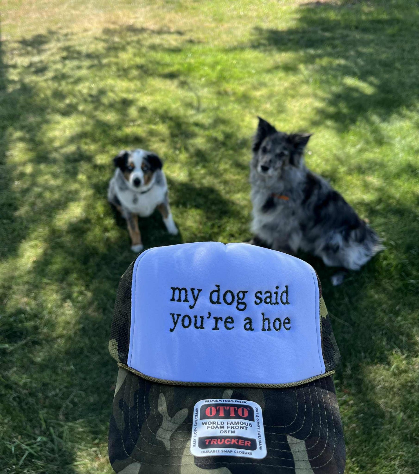 My dog said you're a hoe embroidered trucker hat