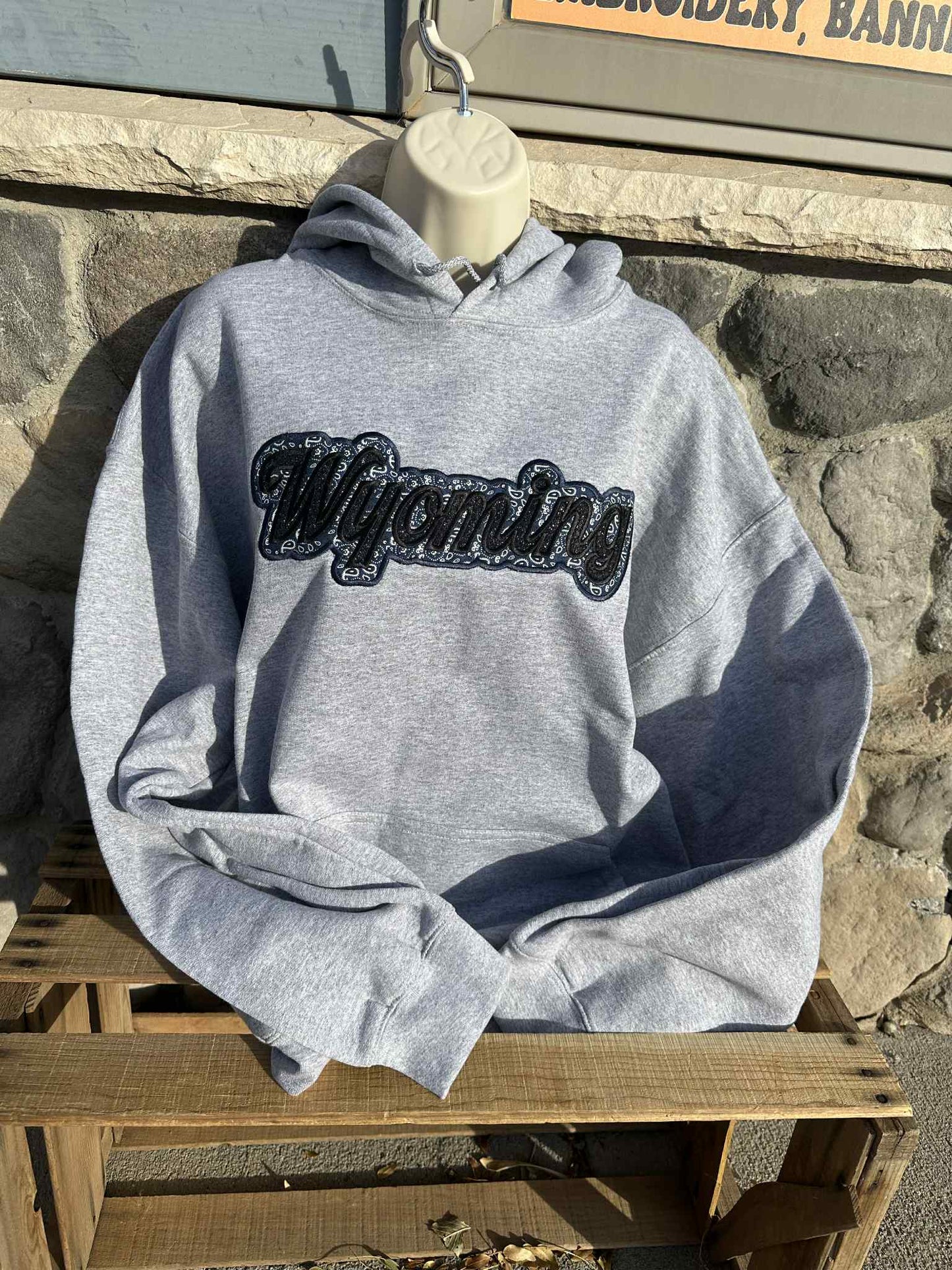 Wyoming black sparkles with blue western applique Embroidery Hoodie