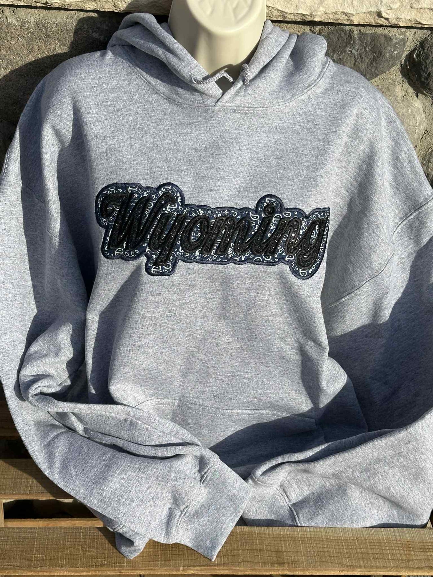 Wyoming black sparkles with blue western applique Embroidery Hoodie