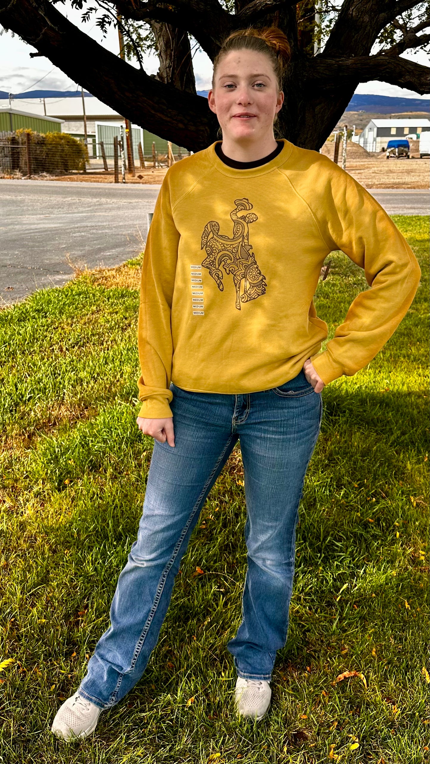 Wyoming Bucking horse on gold long sleeves or crewneck