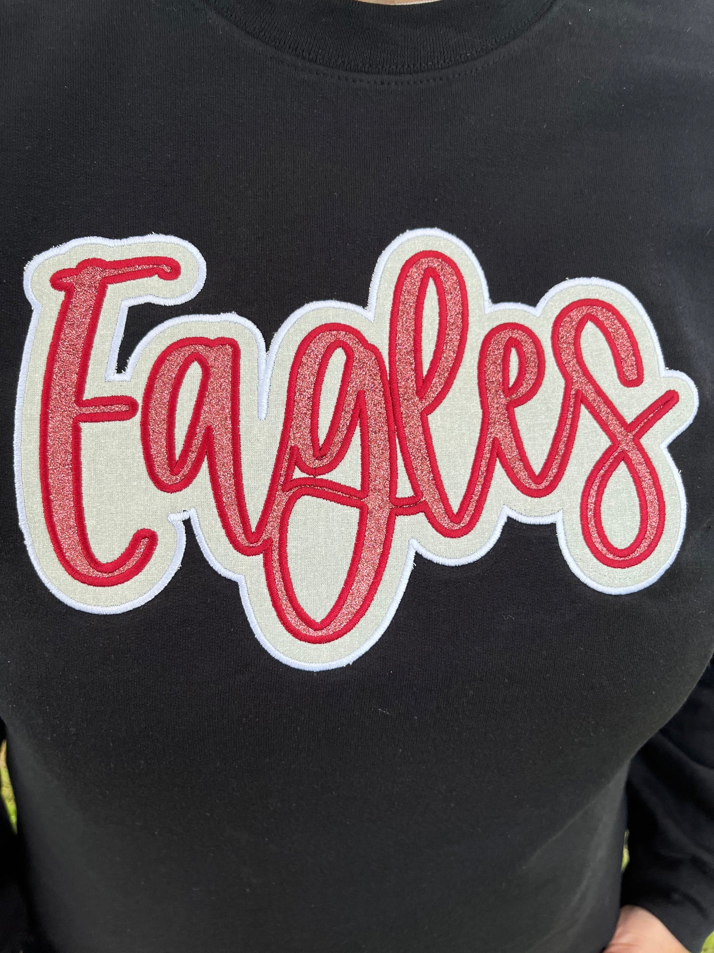 Eagles Maroon and White Glitter Applique Embroidery on Black Crewneck