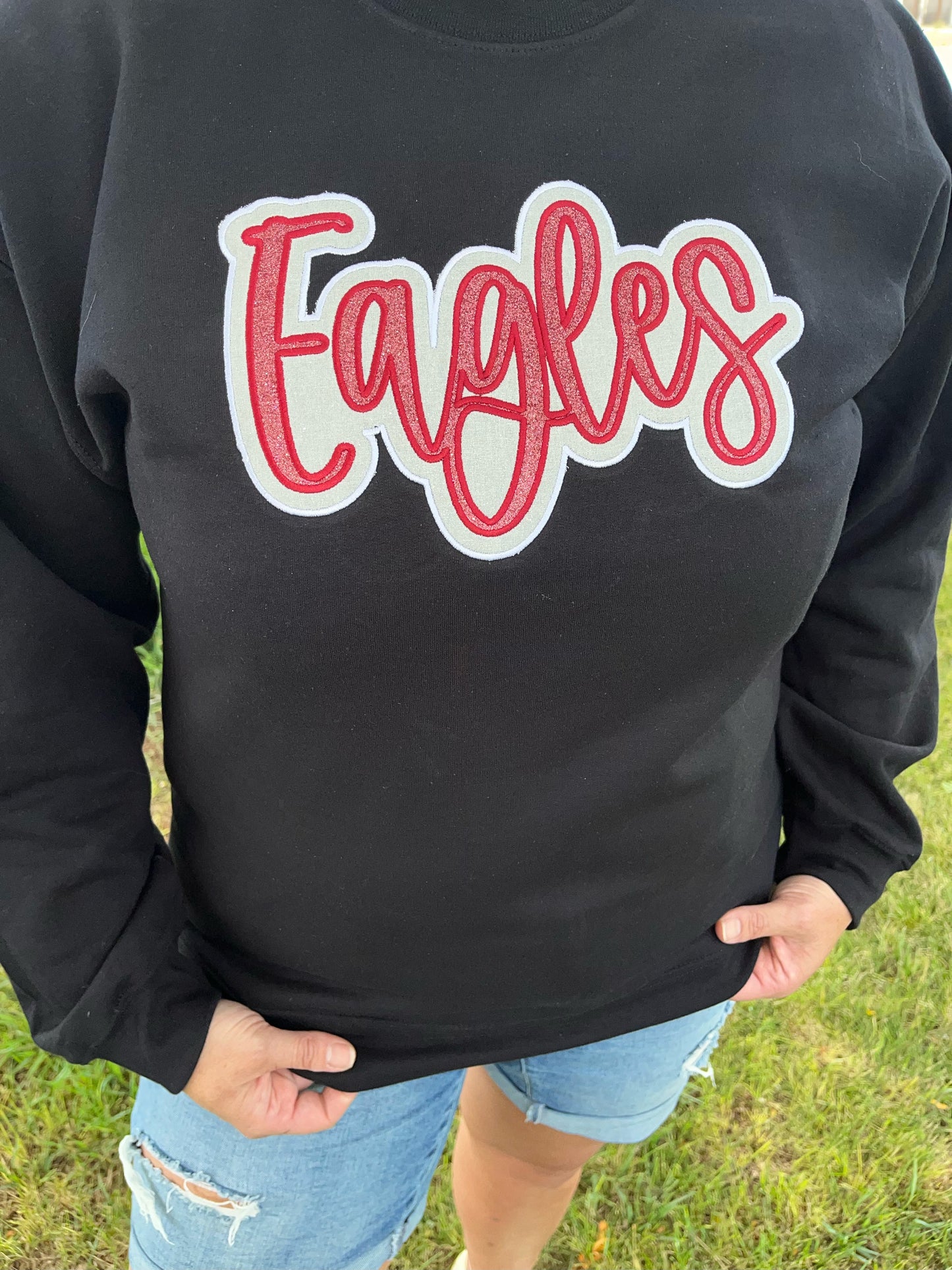 Eagles Maroon and White Glitter Applique Embroidery on Black Crewneck